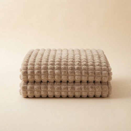 CloudHug Bubble Plush Blanket folded, showing the 3D bubble plush texture